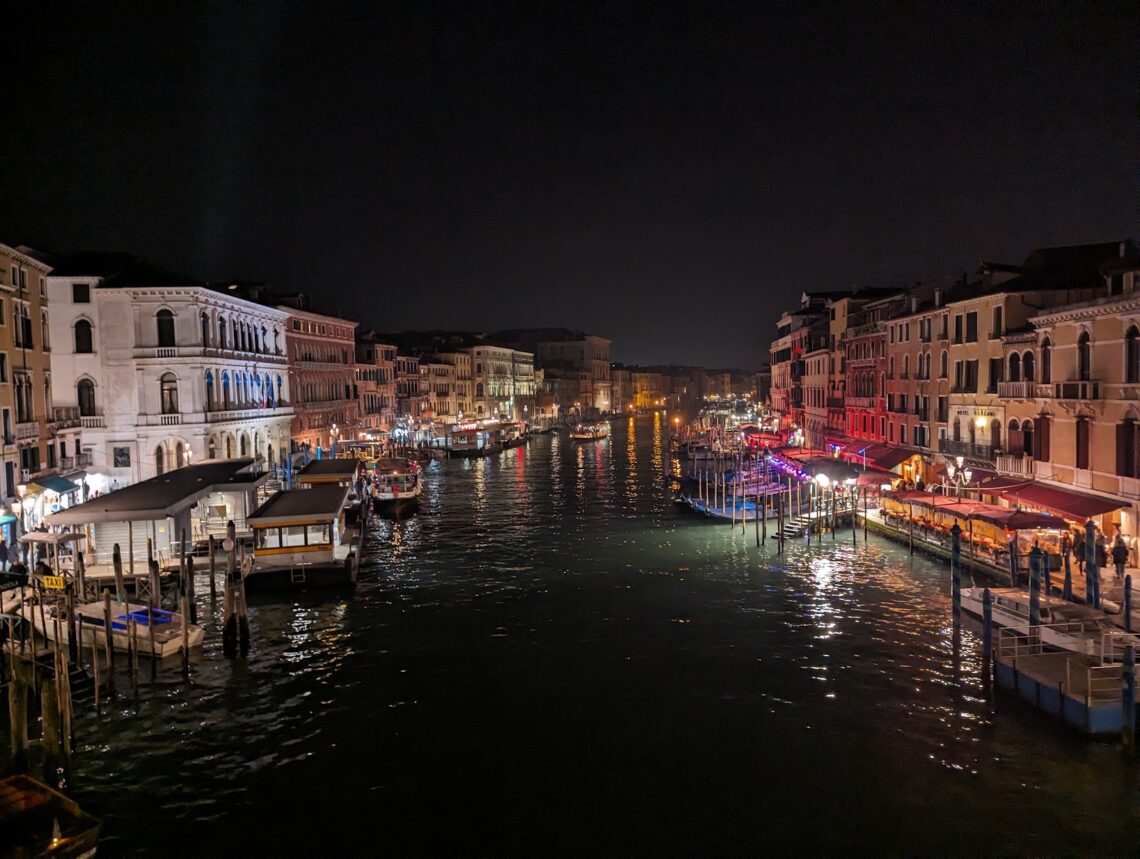 A photo of Venice's grand canal at night.