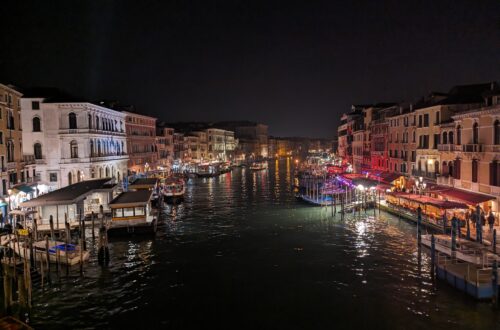 A photo of Venice's grand canal at night.